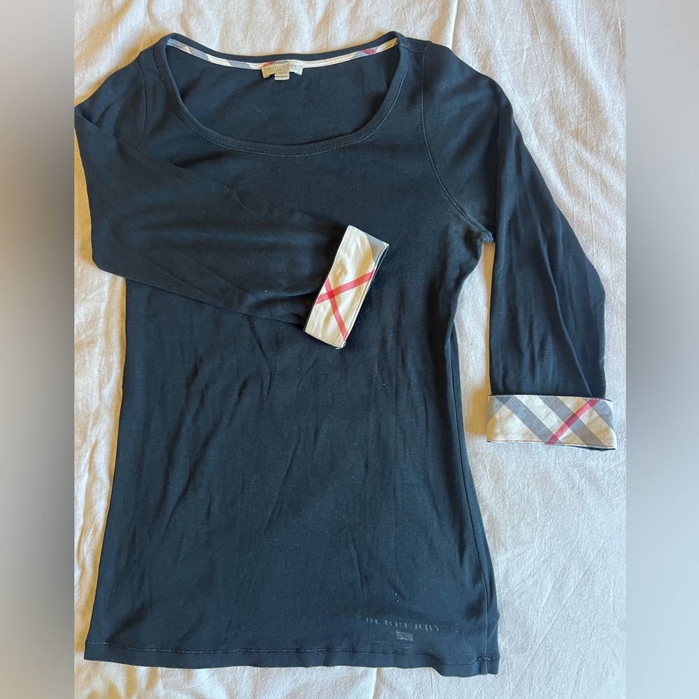 Burberry top. Cool for casual or leisure.